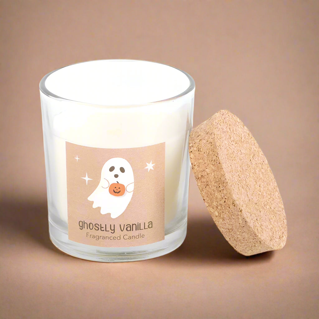 Fragranced candle labeled 'ghostly vanilla' with a ghost design on a beige background