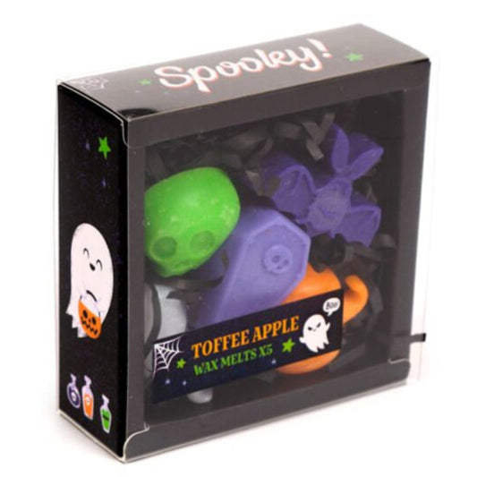 Halloween-themed wax melt packaging with colorful melts inside.
